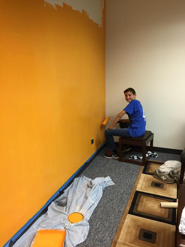 A_mini_Jorgensen_Alex_helping_us_paint_the_company_colors_during_Pimp_my_Office_on_11.14.15.jpg